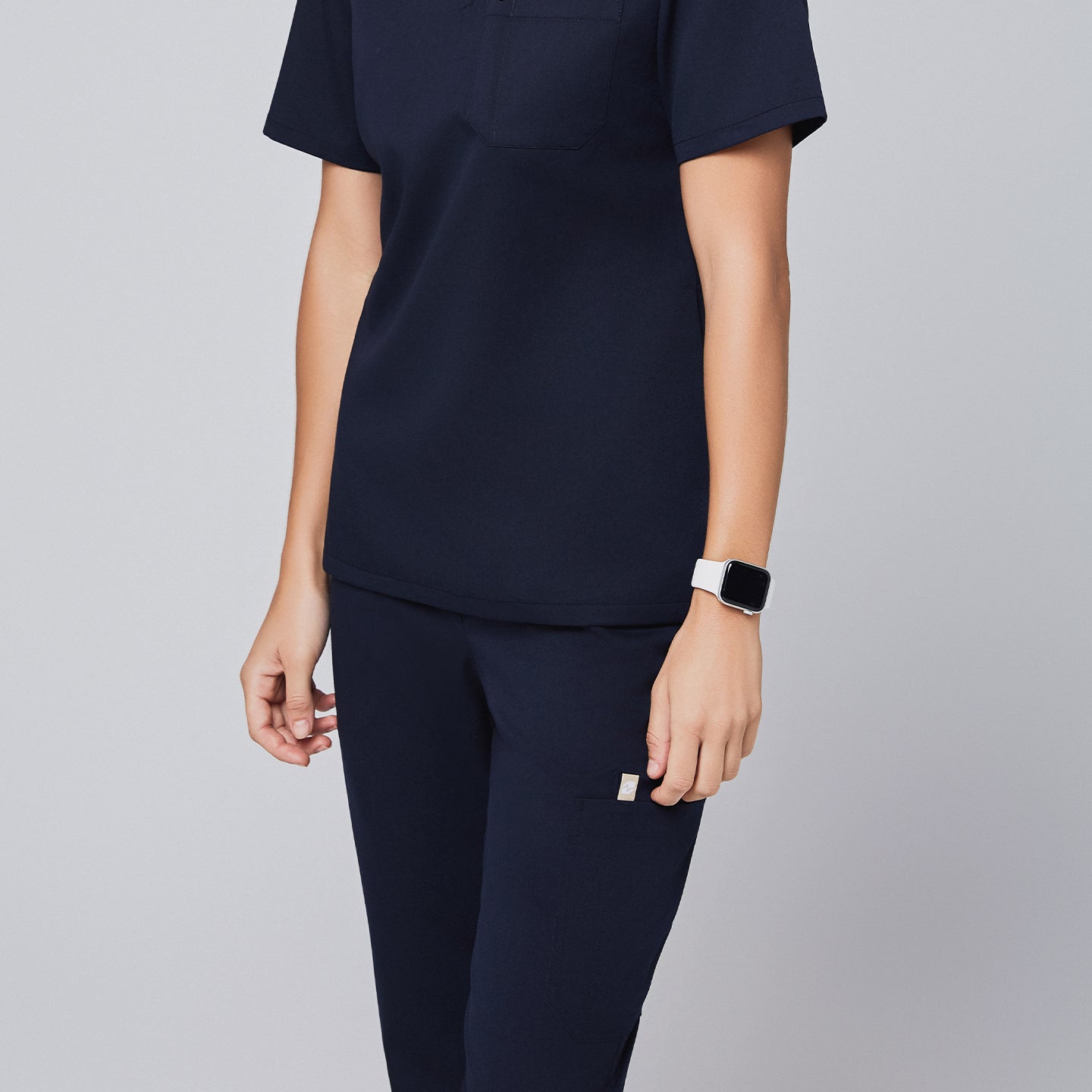 Elegant navy scrub set with attention to detail, offering practicality and a sleek, professional look,Navy