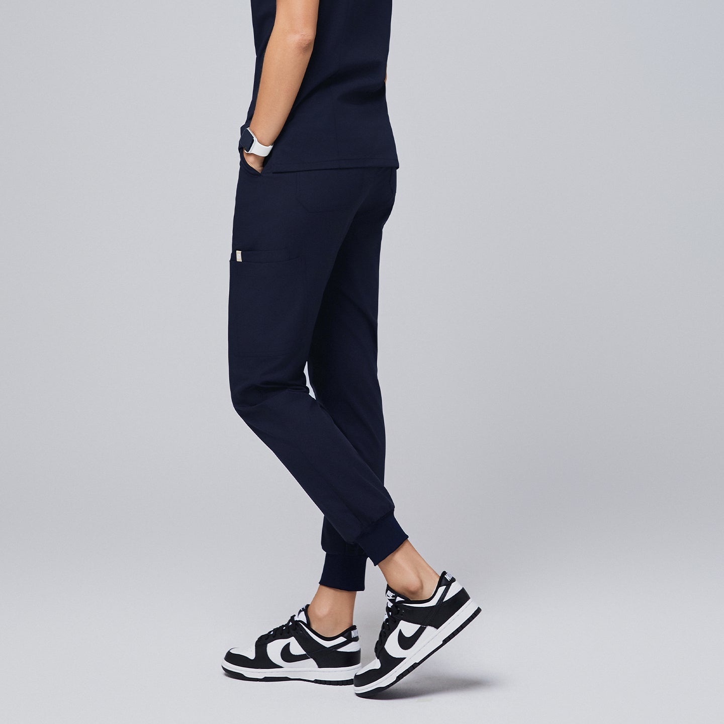 Premium navy jogger scrub pants designed for a comfortable and active workday, featuring functional side pockets and cuffed hems for a tailored fit,Navy