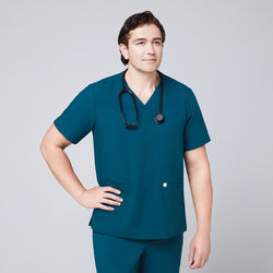 Image of Man in an ocean teal scrub set with a double-pocket V-neck top, wearing a black stethoscope around his neck,Ocean Teal