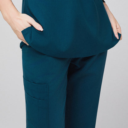 Teal scrub pants with side pocket detail, hand resting in top pocket,Ocean Teal