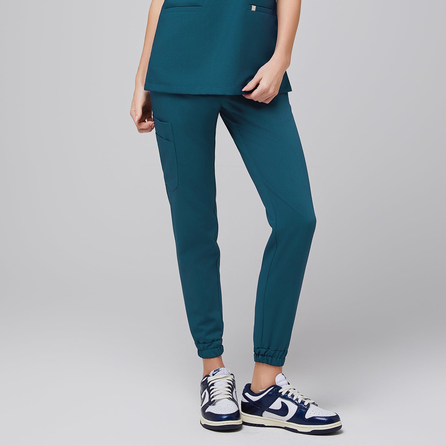 Close-up of Ocean Teal StretchFit Jogger Scrub Pants, showing an elastic ankle cuff and a side pocket,Ocean Teal