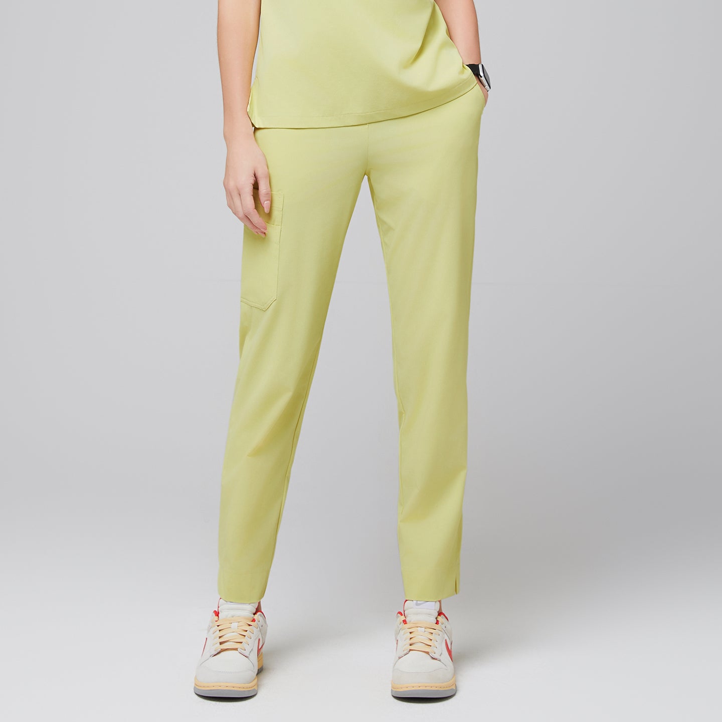 Female wearing pineapple yellow scrub pants with side pocket, paired with beige sneakers,Pineapple Yellow