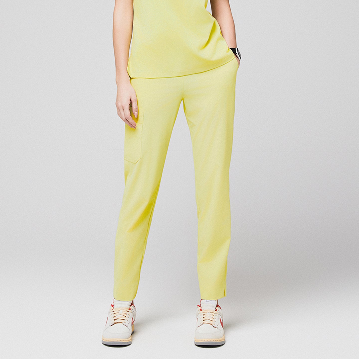 Yellow scrub pants with side pocket and split hem, paired with white sneakers,Pineapple Yellow