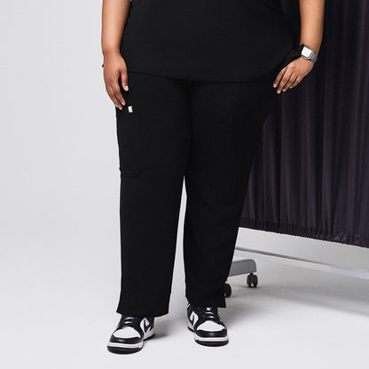 Black scrub pants with split hem and side pocket, paired with black and white sneakers,Rich Black