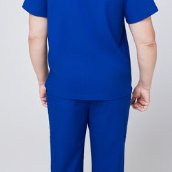 Image of Back view of a person wearing royal blue scrub top and pants, showcasing the rear design of the uniform with pocket details,Royal Blue