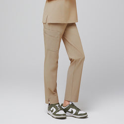 Image of Female wearing sand beige scrub pants with side pocket and green sneakers,Sand Beige