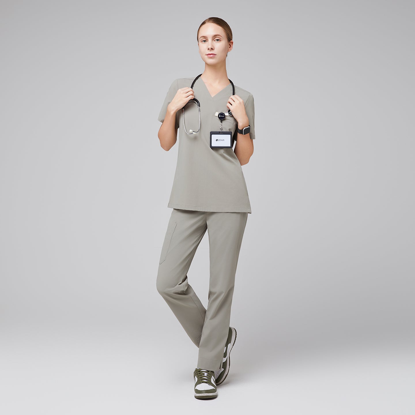 Female wearing sand khaki V-neck scrub set with stethoscope and green sneakers,Sand Khaki