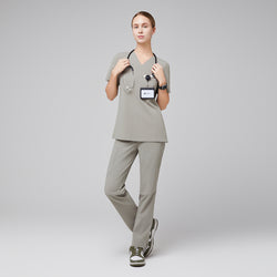 Image of Female wearing sand khaki V-neck scrub set with stethoscope and green sneakers,Sand Khaki