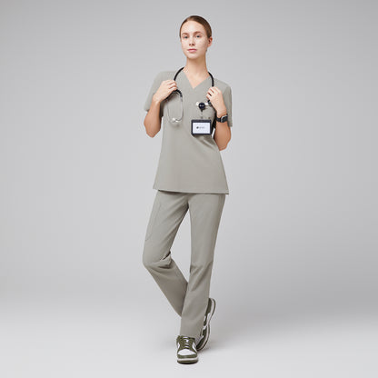 Female wearing sand khaki V-neck scrub set with stethoscope and green sneakers,Sand Khaki