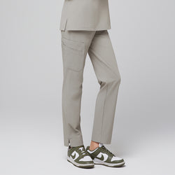 Image of Female wearing sand khaki scrub pants with side pocket, paired with green sneakers,Sand Khaki