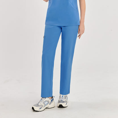 Woman in sky blue split hem scrub pants and matching top, showcasing the pants from the front,Sky Blue