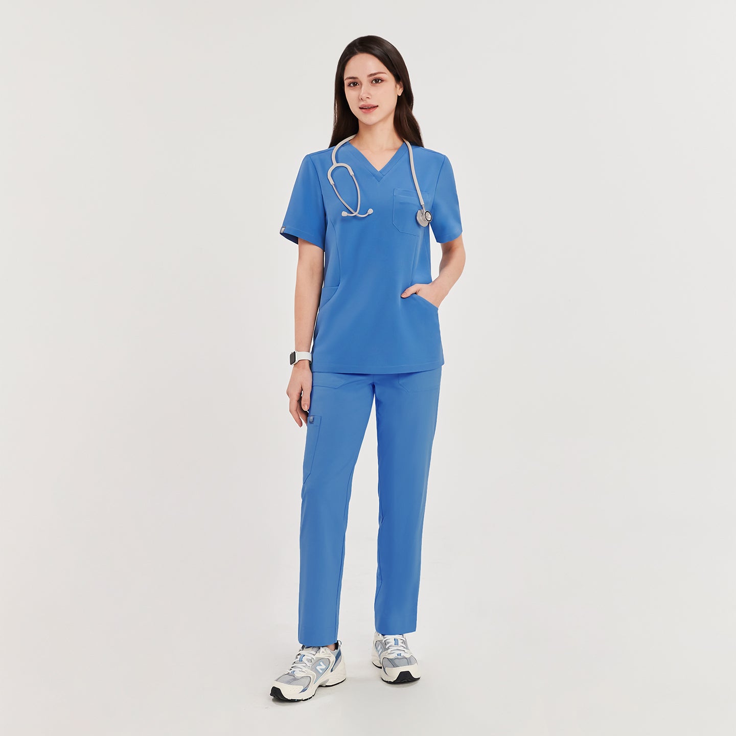  Woman in sky blue zipper slit scrub pants and matching top, standing with a stethoscope around her neck, showcasing the full outfit,Sky Blue