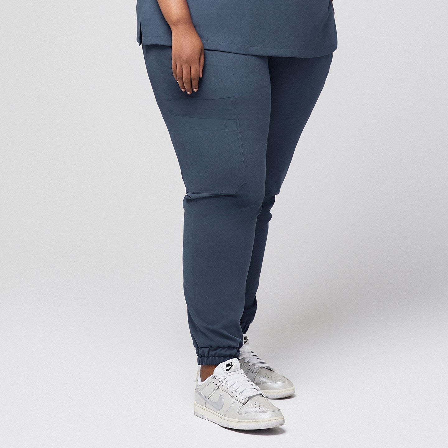 Smoky blue stretch fit jogger scrub pants with side pocket, worn with white sneakers,Smoky Blue