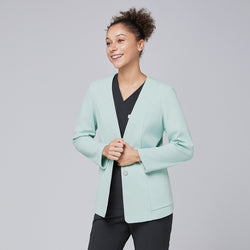 Image of A smiling woman wearing a soft mint comfort cardigan over black scrubs, showcasing a polished and modern professional look,Soft Mint