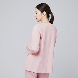 Image of A woman seen from the back wearing a soft pink comfort cardigan, showcasing its clean back design and smooth fabric, paired with matching trousers,Soft Pink