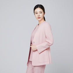 Image of A woman wearing a soft pink comfort cardigan with a button closure and matching V-neck top and trousers, posing in a side angle against a plain background,Soft Pink