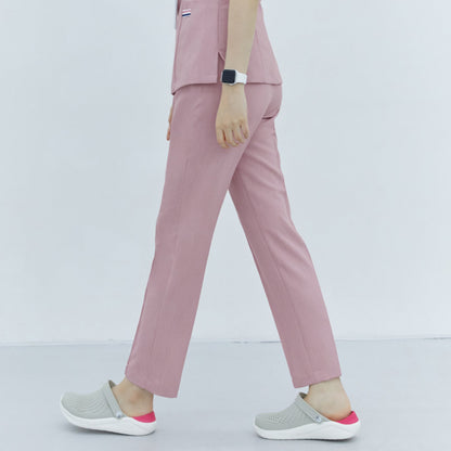 Soft Pink Line Banding Scrub Pants, side view, showcasing the sleek design and tailored fit, paired with gray shoes,Soft Pink
