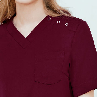 Woman wearing a 3-button scrub top with a chest pocket and detailed stitching near the neckline,Burgundy