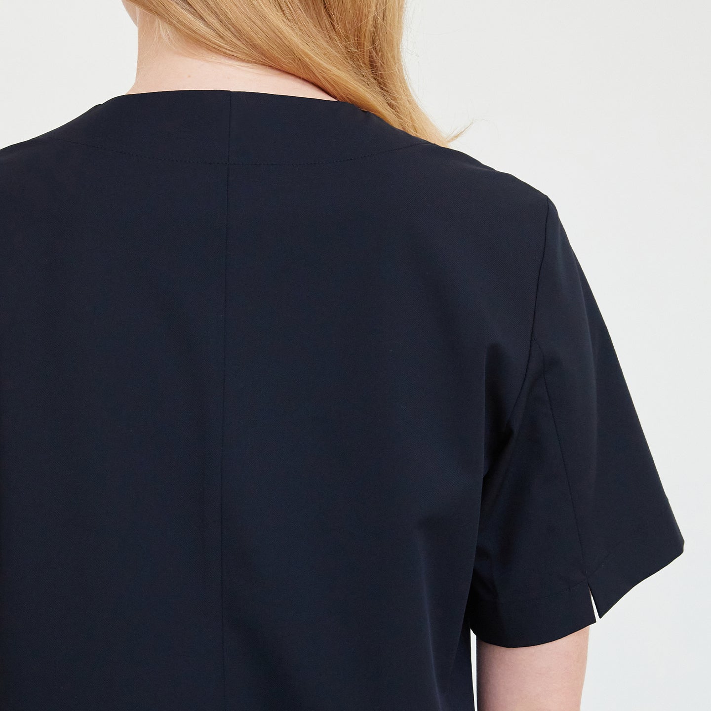 Close-up of the back detail of a woman's scrub top,Navy