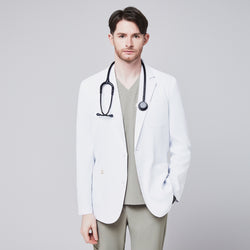 Image of Front view of a male model wearing a white short lab coat over olive green scrub pants, showcasing clean and tailored design,White