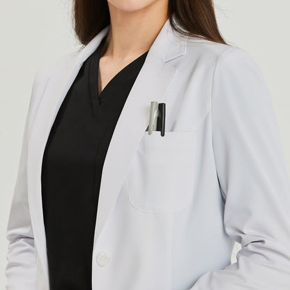 Close-up of a woman wearing a white lab coat over a black scrub top. Two pens are visible in the chest pocket,White