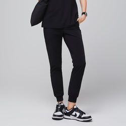 Image of Close-up of Midnight Black Zipper Pocket Jogger Scrub Pants, showing the side pocket and elastic ankle cuff,Midnight Black